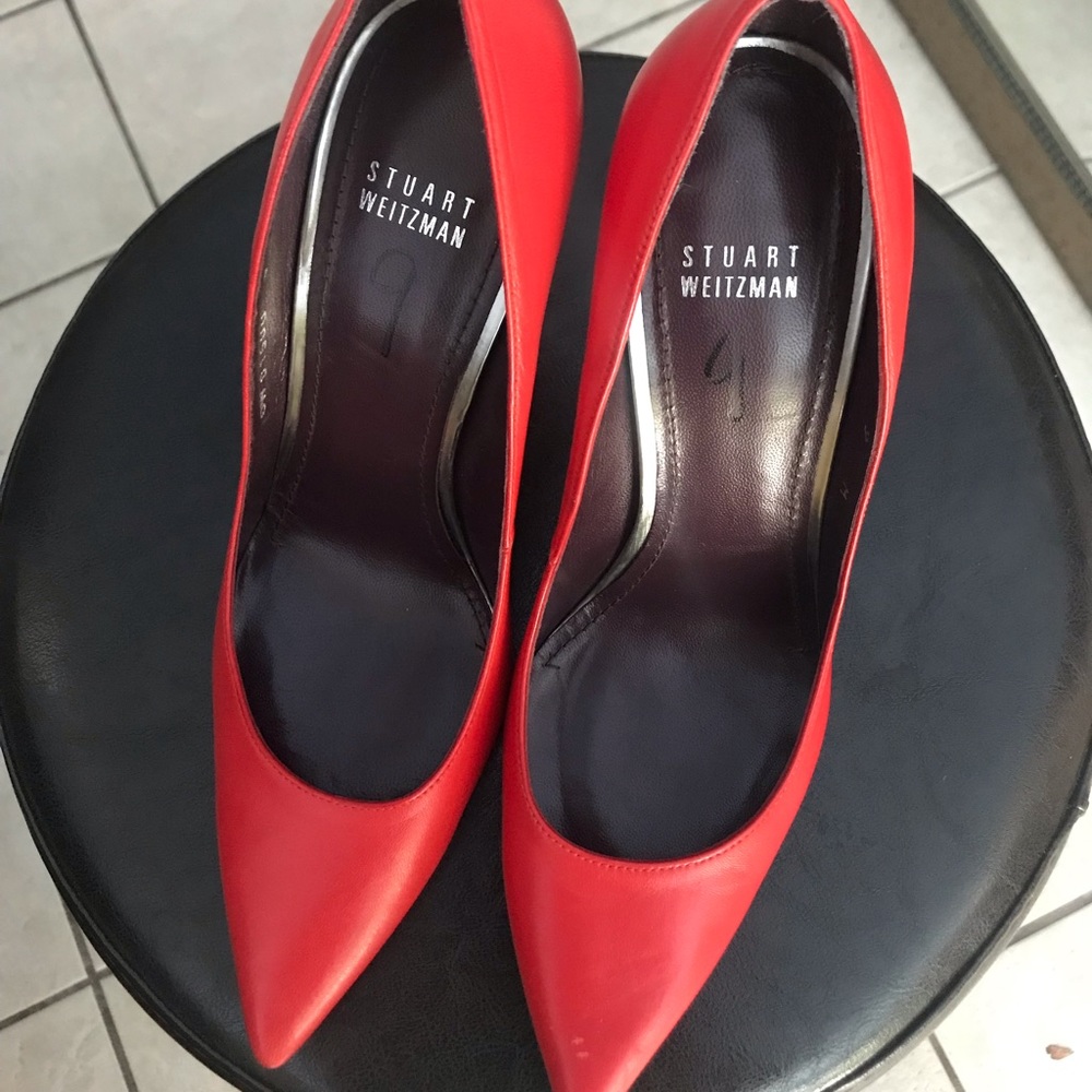 Genuine leather Stuart Weitzman pump heels.